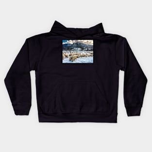 Flock of sheep at the bottom of the mountain Kids Hoodie